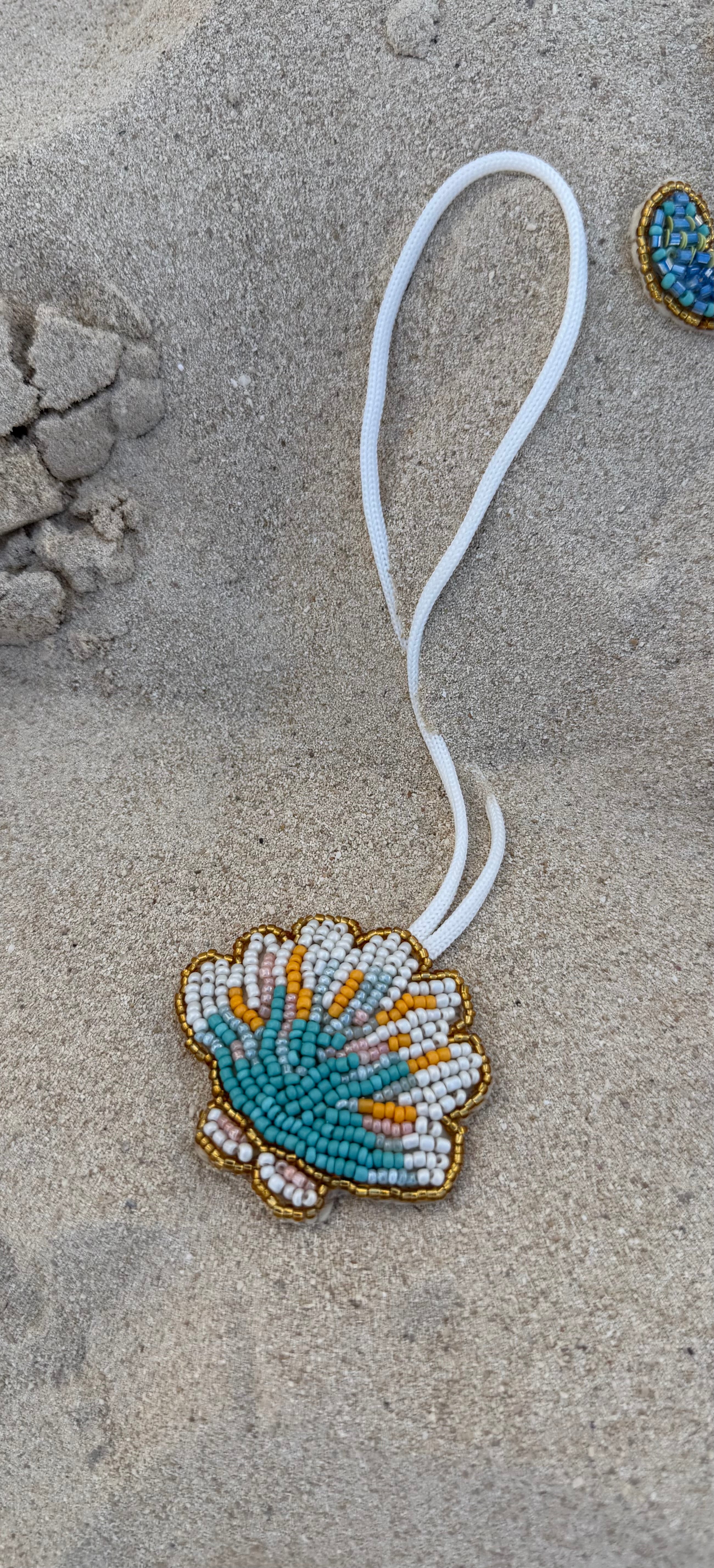 Seashell charm embroidery